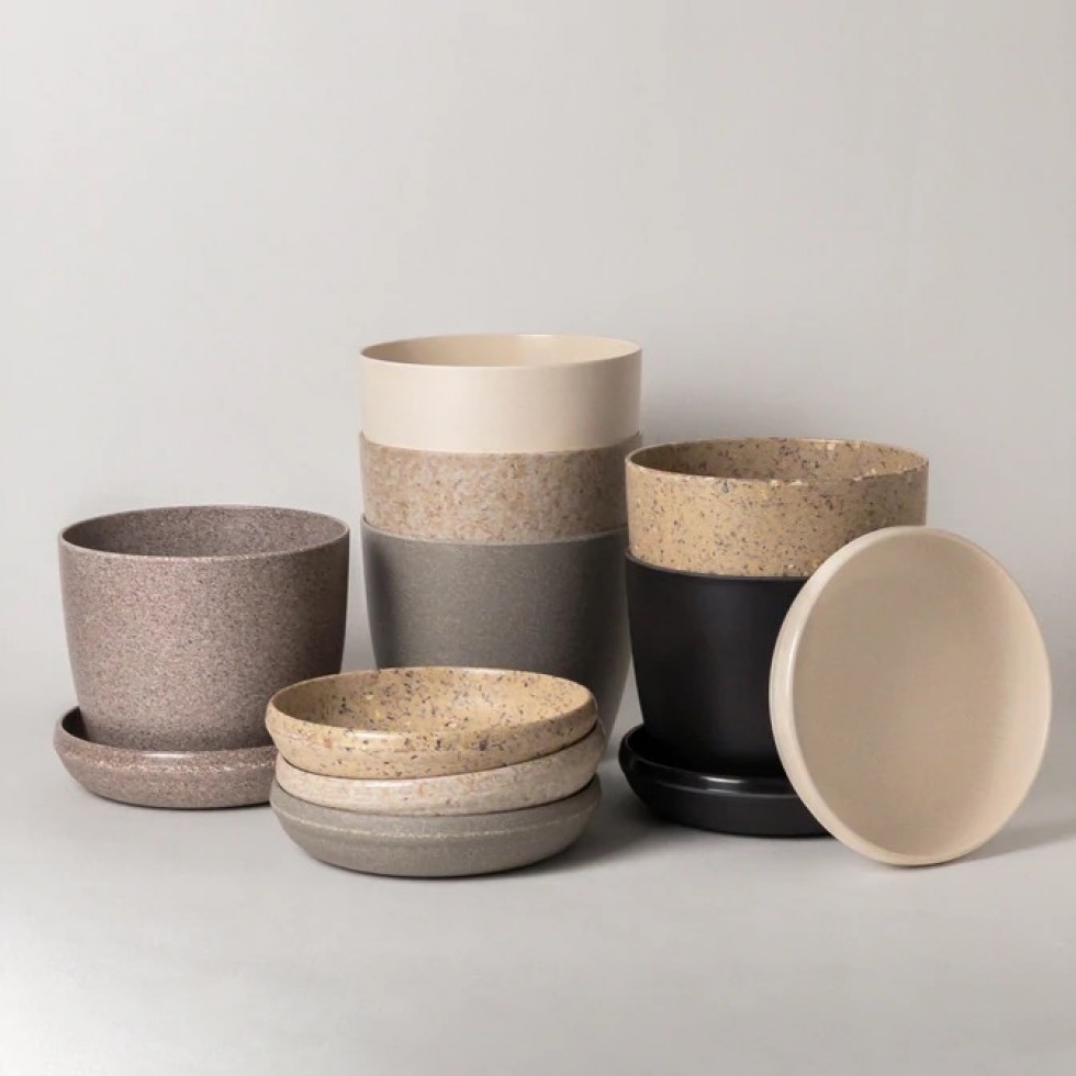 Pots made from agricultural by-products and waste materials